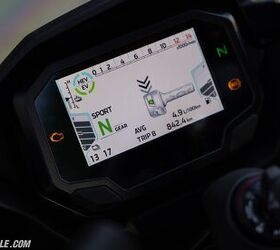 There’s a small learning curve to get acclimated to the Ninja 7, and it starts with the display. Here you can see the bike is already in Sport mode and is in neutral. The gauge to the left shows battery state of charge, and the right is a normal fuel gauge. The upper left shows battery temperature. The circular display next to it displays Hybrid or EV status. As shown, two blue and two green bars means both hybrid and EV systems are fully operational (and E-Boost can be used).