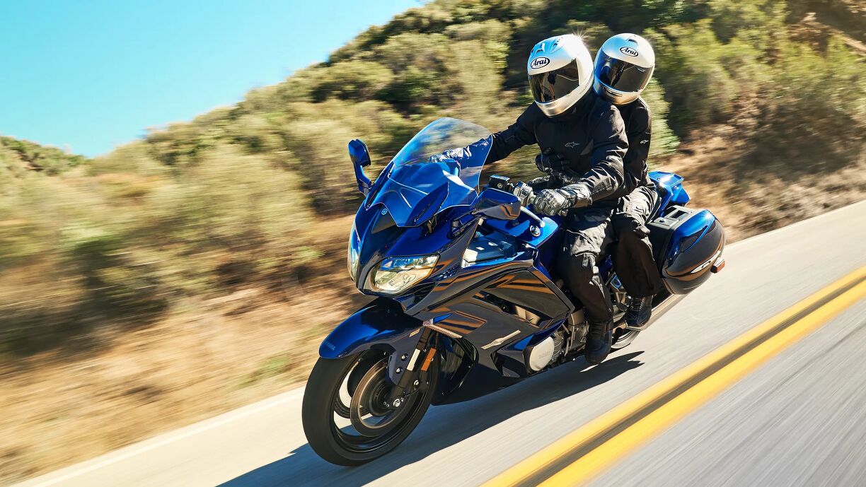 Person Rider Riding With a Passenger | Motorcycle.com