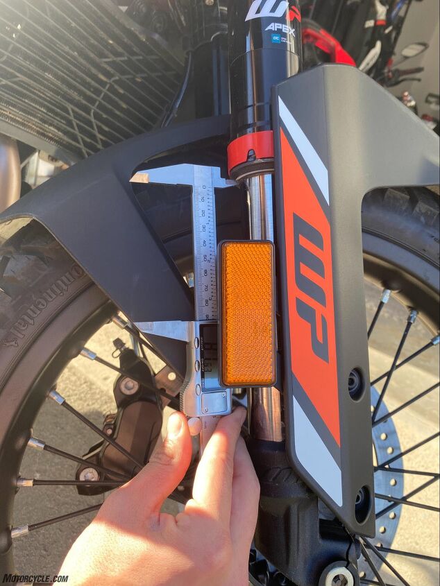 Measuring the fork to check how much of the travel is used under heavy braking. KTM provides o-rings on the inner fork tubes so you can easily see how much of the suspension you’re using.