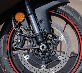 A 320mm disc, radial caliper, and steel lines are a great thing to see on an entry-level bike. Note also the Aprilia-branded tires. For our track test, Aprilia fitted Pirelli Supercorsa SP V4 rubber on each bike.