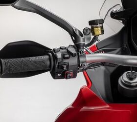 The button above the gray Mode button is a dedicated suspension button, allowing for adjustments while the bike is in motion.