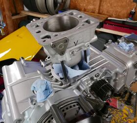 To push the gudgeon pin through the piston and connecting rod assembly, I had to sneak the piston out the bottom of the cylinder. But to get it far enough out the bottom to fit the pin meant flirting with having a piston ring pop out of the bore, too. I lived in constant fear of breaking a ring. 