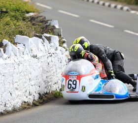 Sidecars use all the road…and occasionally the walls...on the Billown circuit at the Southern 100. Photo by Southern 100 Press/CJS Photography/Callum Staley.