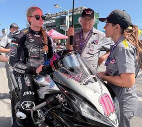 Here, Melissa Paris keeps Ella cool, calm, and collected while waiting 45 minutes on grid. Holding the umbrella is the team's main sponsor, proof that small teams require everyone to pitch in.