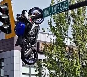 WTF? Motorcycle Left Hanging From Traffic Light After Crash